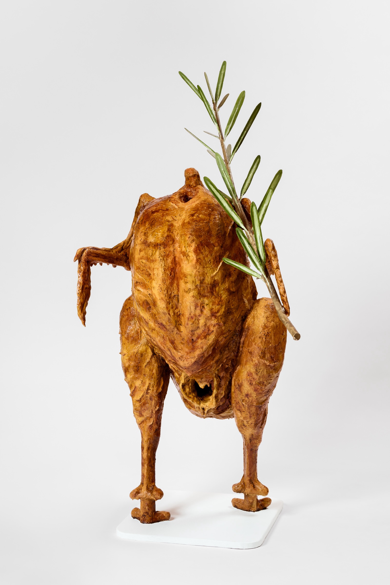 Sculpture of a roasted chicken reanimated and walking