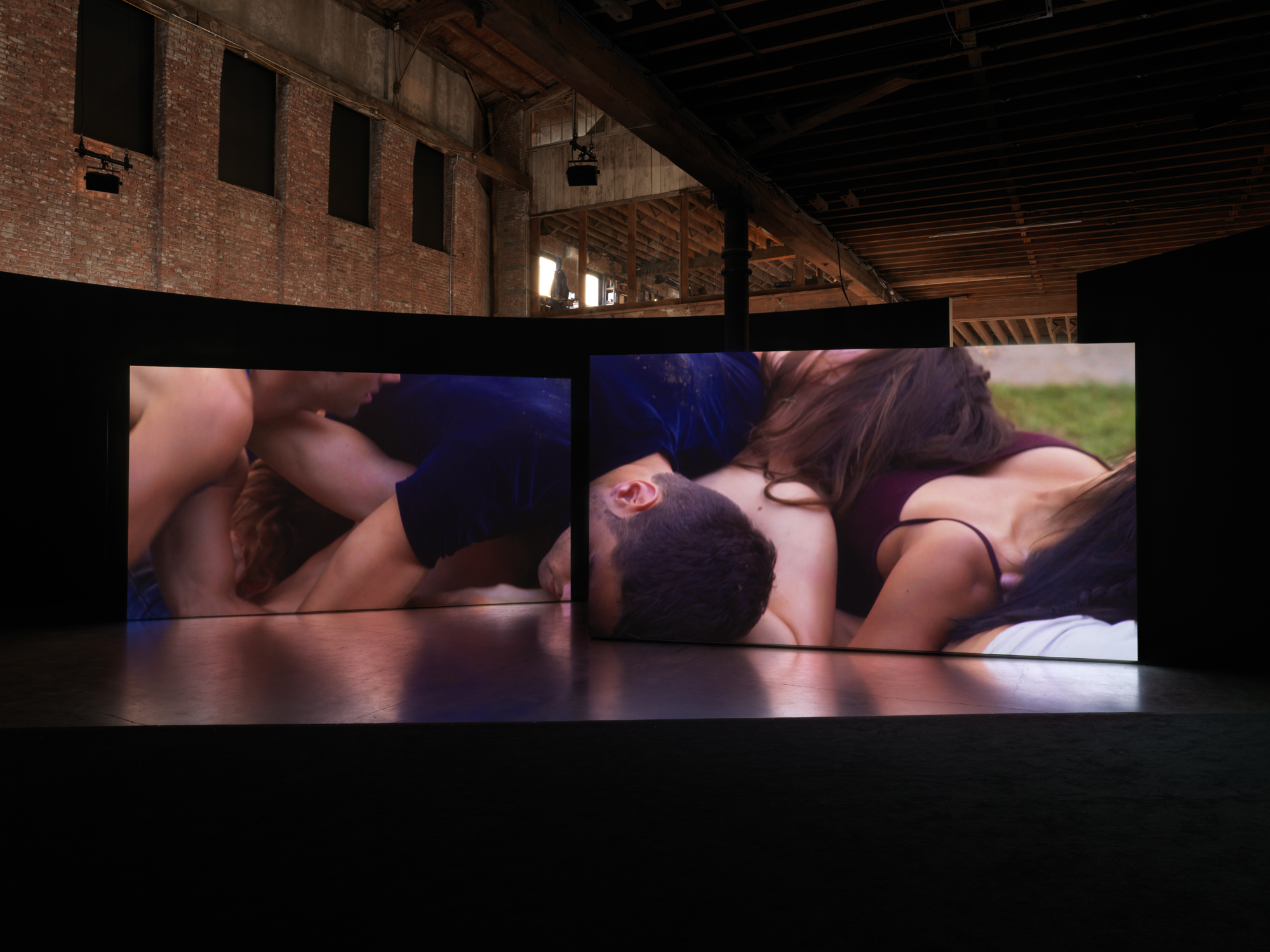 Two large projects of dancers whose bodies writhe together are projected into two synchronized video channels.