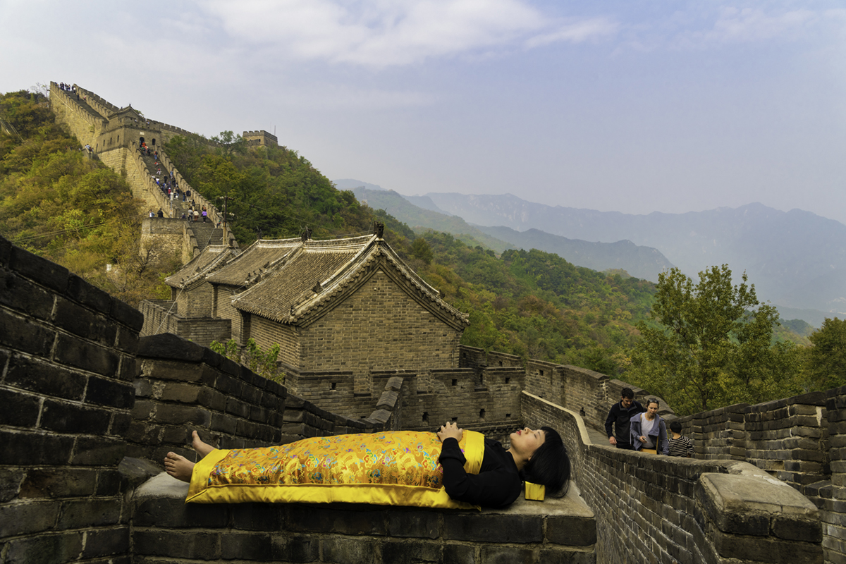Chun Hua Catherine Dong sleeps on the Great Wall in Beijing