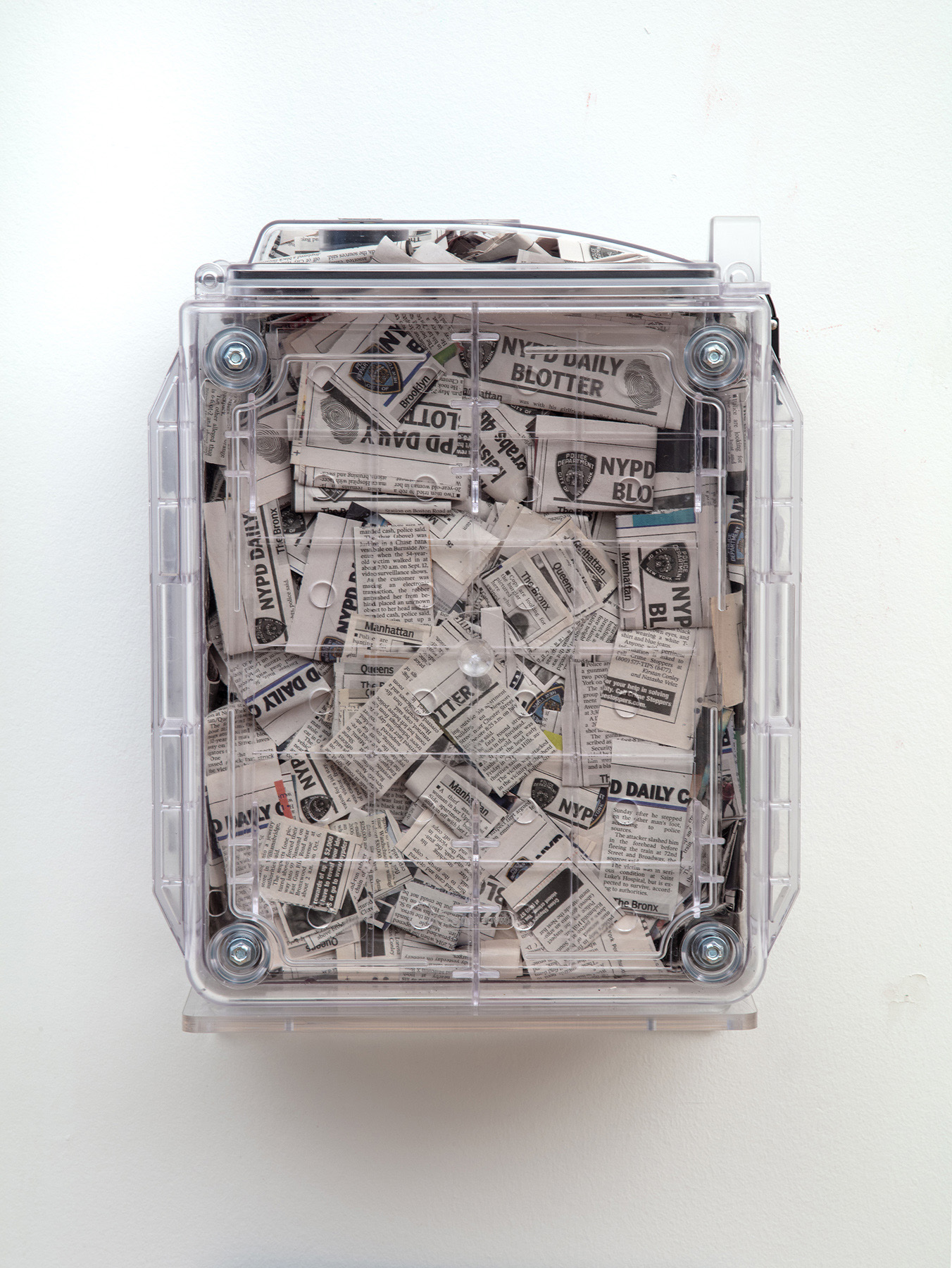 Blotter is another airtight desiccator box filled with an archive of the NYPD daily blotter clipping which ended its daily run in the printed paper in 2017.