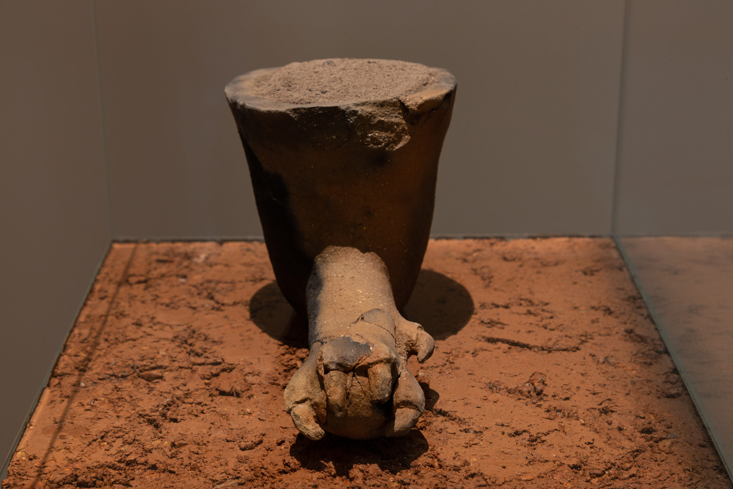 RED FLOWER #3, 2021 TERRACOTTA, ASHES, GLASS, RAMMED EARTH 255.6 x 71.1 x 71.1 IN INSTALLATION VIEW, 'RED FLOWER', BRUNO MÚRIAS GALLERY, 2021 PHOTO - BRUNO LOPES