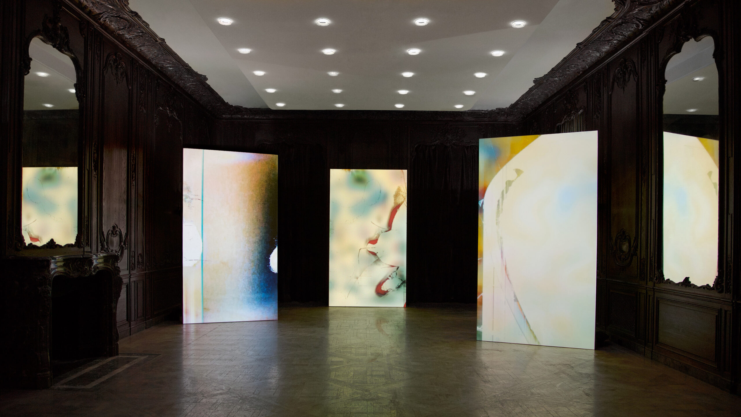 Installation view of bright vertical panels on dark room. In situ at the exhibition “Elias Wessel—It's Complicated, Is Possibly Art;” 1014 New York, 2022