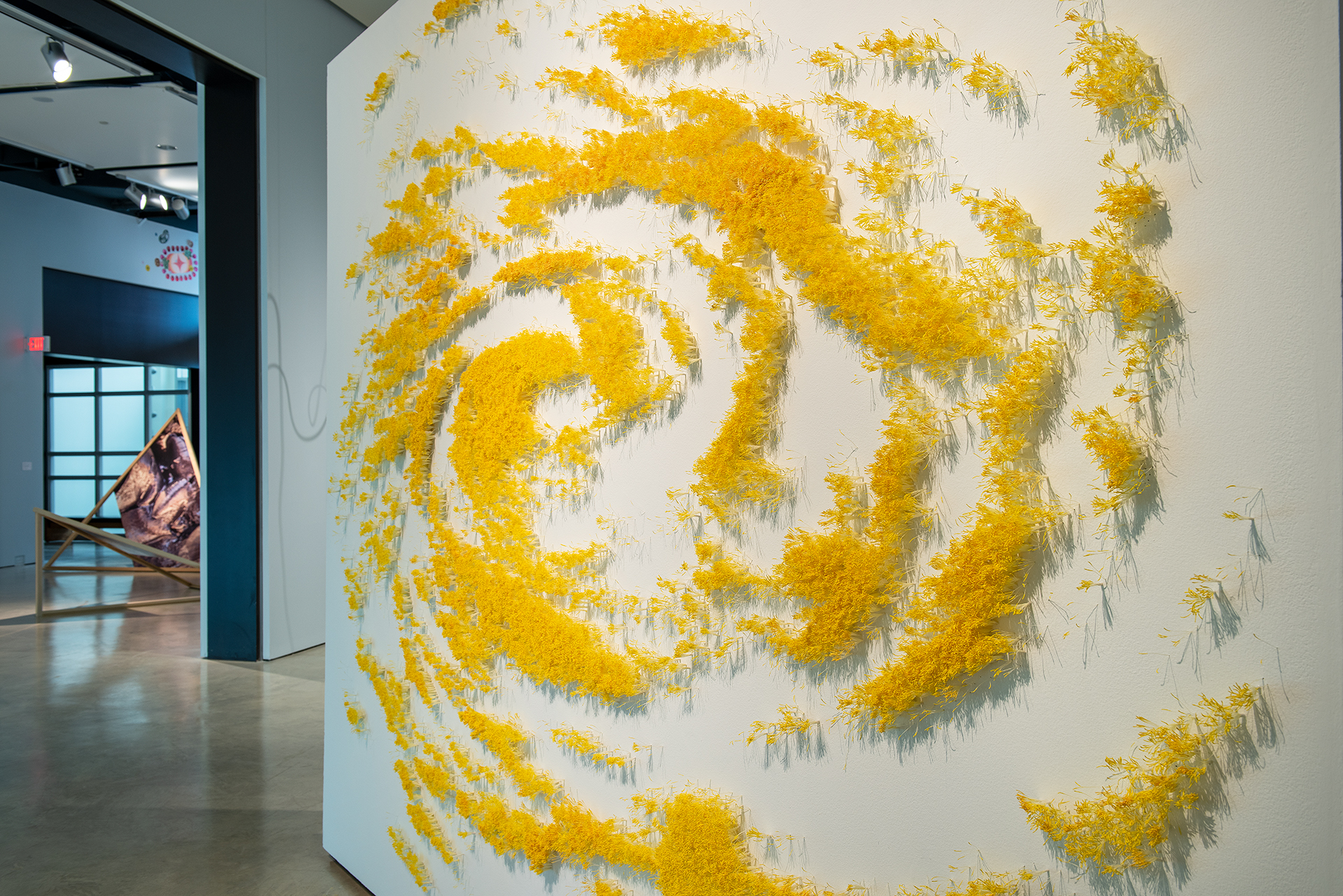 In this project, I use tens of thousands of artificial flower stamens to create a satellite image of a storm, representing the effects of climate change. The stamen, a flower's male reproductive part, is essential for plant growth, and here, artificial stamens symbolize human intervention in nature. This artwork highlights how climate change impacts pollinators and plant populations, similar to the butterfly effect. The storm cloud imagery and an olfactory component, emitting the scent of rain, remind viewers of climate change's power and potential consequences, blending synthetic materials with natural elements to reflect humanity's attempts to control and preserve nature.