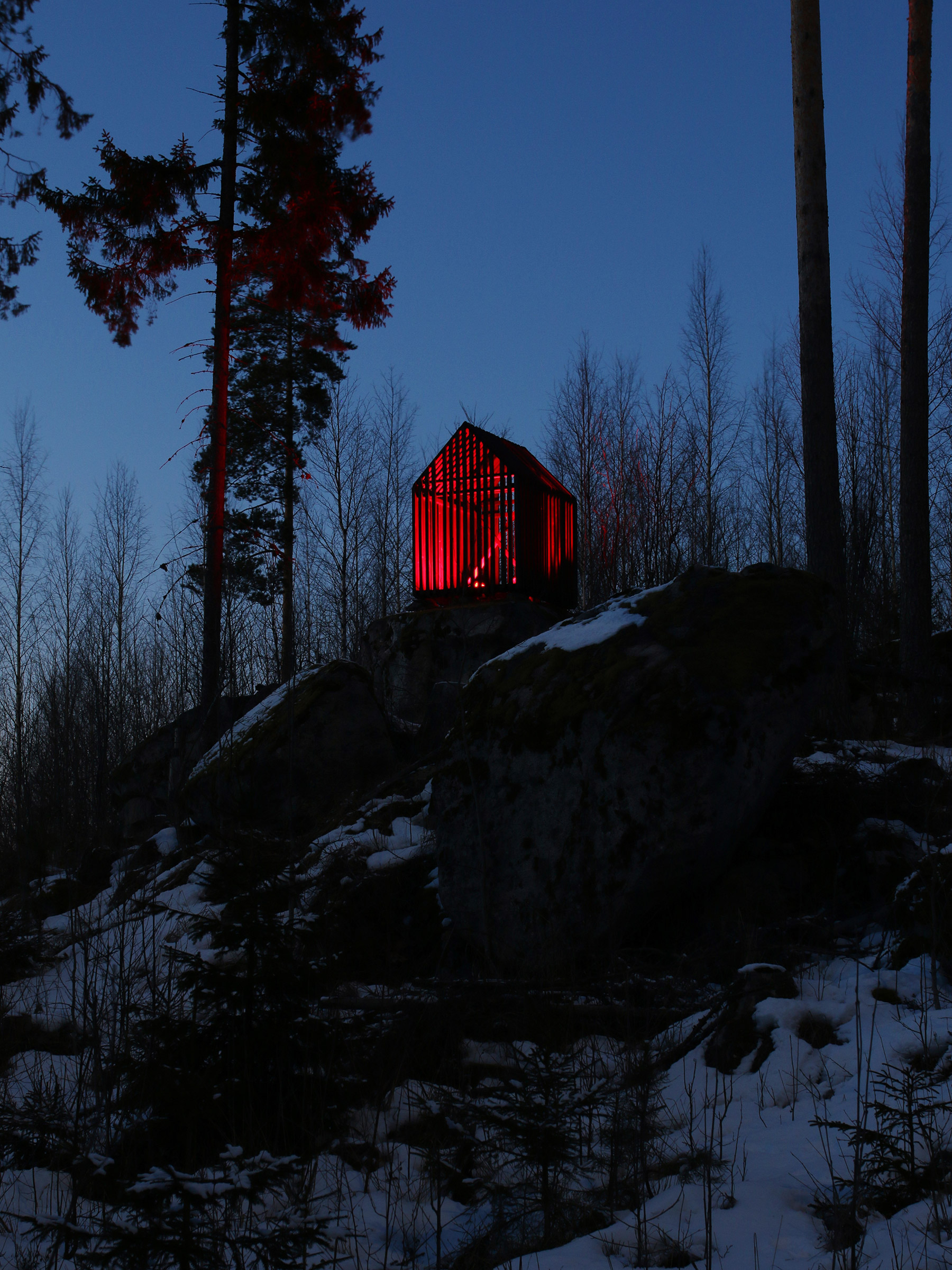 2×3 (Heartbeat) deals with loneliness and isolation. The installation is installed on a rocky outcropping in a remote forest in Asikkala, Finland. The piece consists of a life-size wooden house containing an animated light. Its title refers to the Elvis Presley song “Heartbreak Hotel”, and the light is animated to pulse to the rhythm of that song. 2×3 (Heartbeat) was installed in 2013 with a support from the Finnish Cultural Foundation. The installation still exists in its original location.