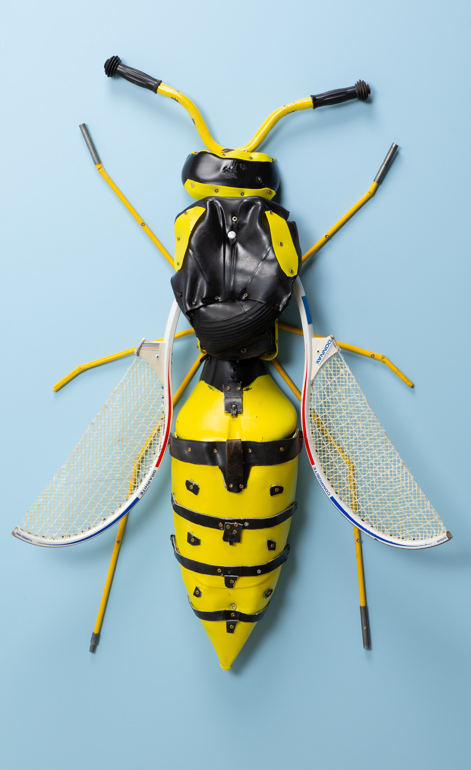 A giant wasp with wings made from tennis rackets.