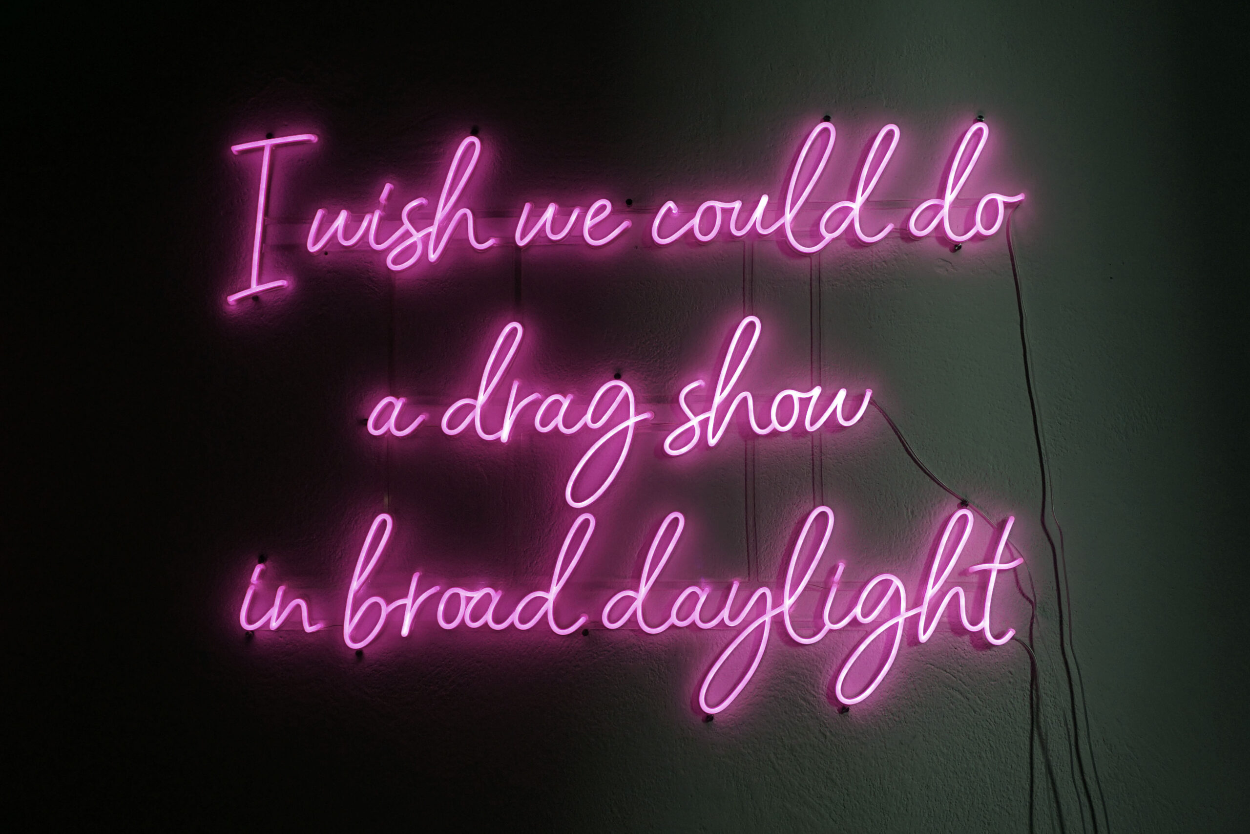 Pink neon in three lines: I wish we could do a drag show in broad daylight
