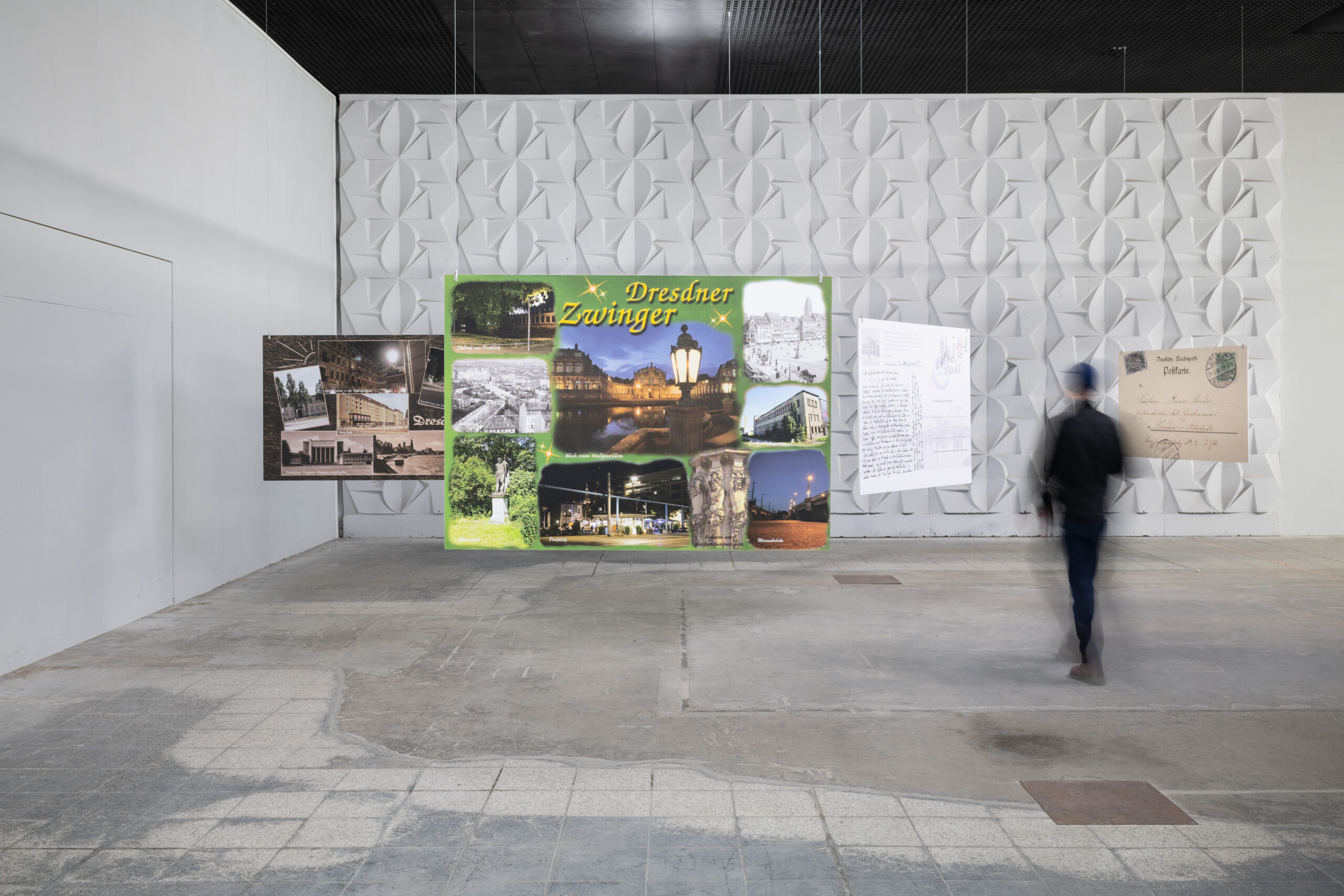 Series of 5 big-sized postcards, hanging from the ceiling, showing queer local histories