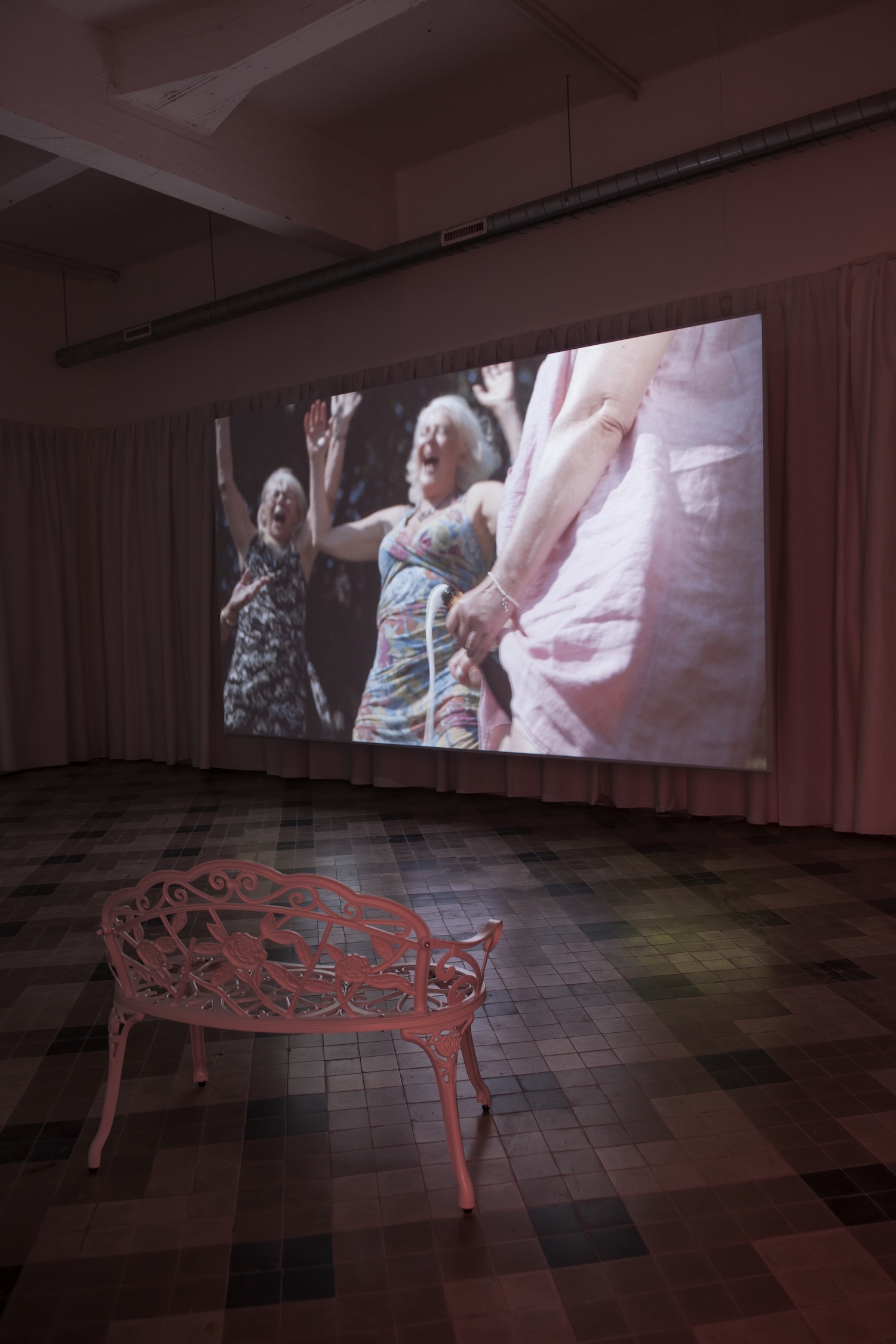 video, curtain, garden benches. Curated by Zoë Gray & Helena Kritis.